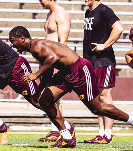 JJ Calip sprinting in RISE training gear